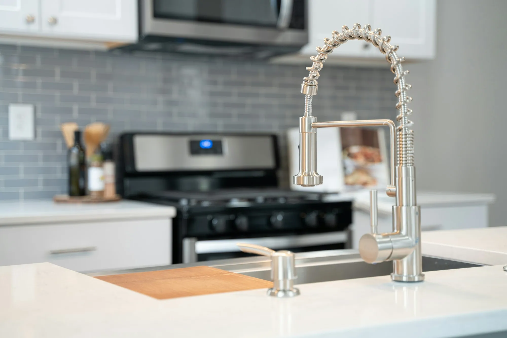 Bright kitchen with a stainless pull-down faucet