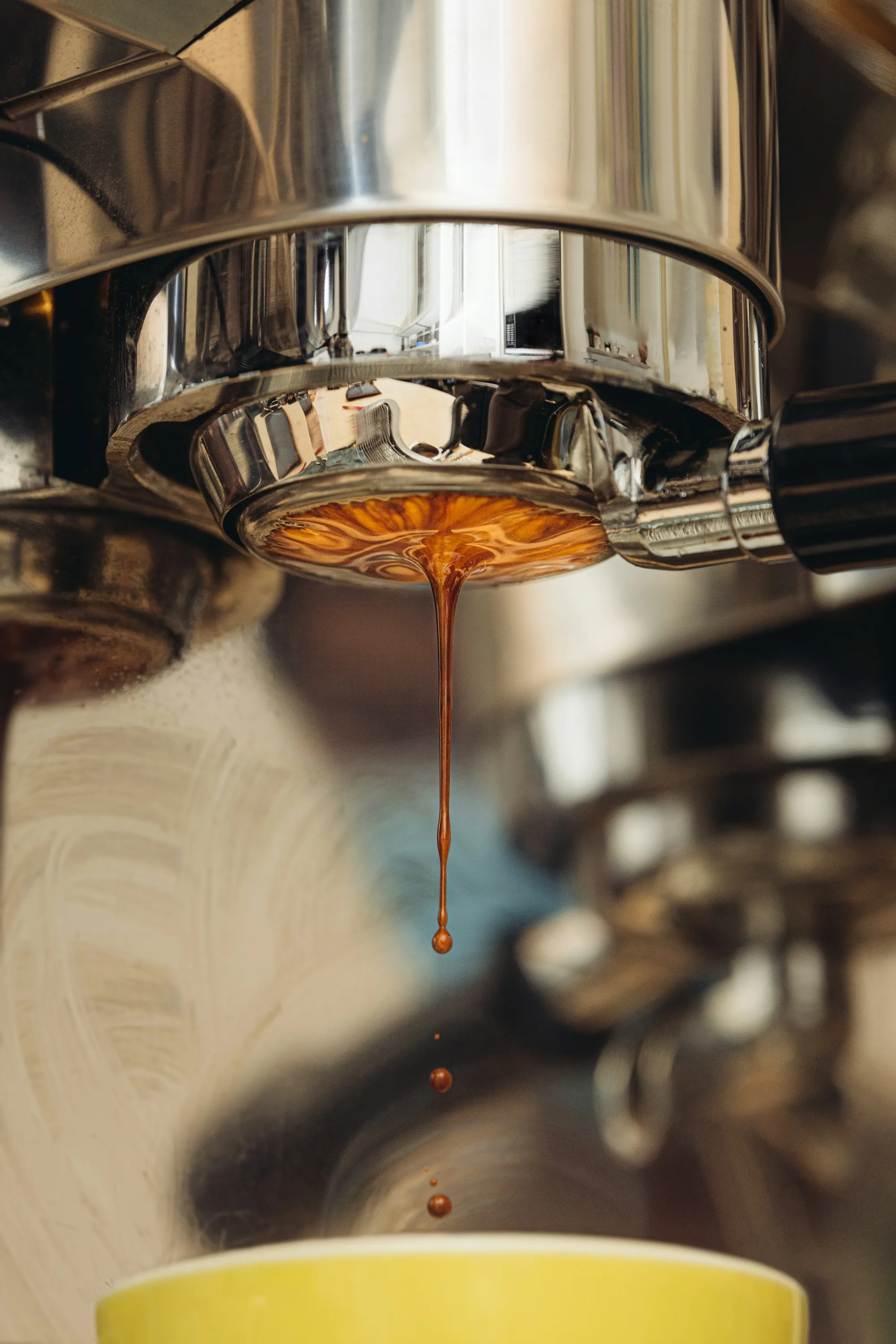 Espresso pouring from a cafe machine