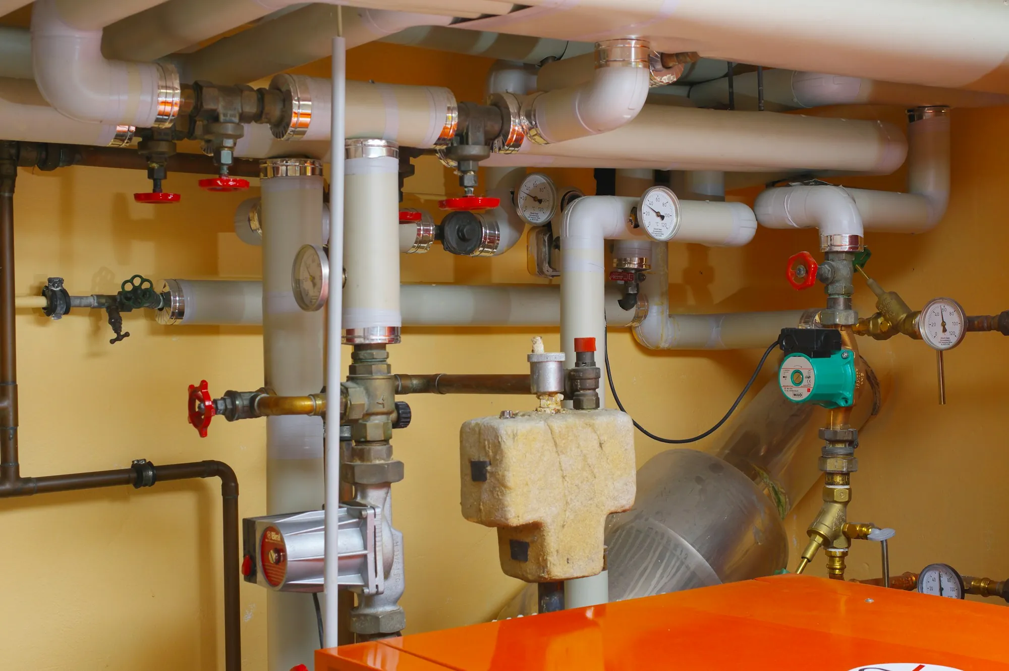 Pipes, valves and gauges in a home utility room